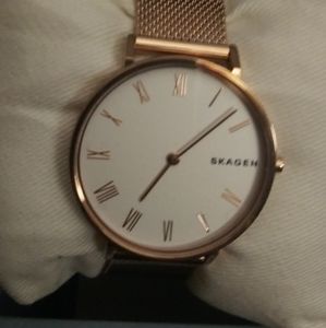 Womens Skagen hald. Rose gold tone watch